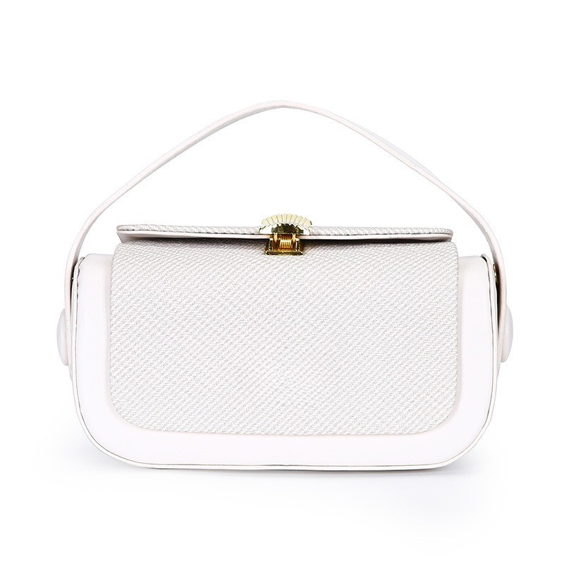 Handväska i PU-läder, formfast design och innerfickor