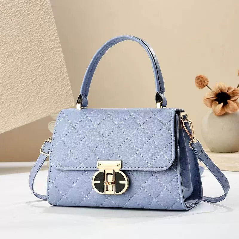 Elegant handväska med lås – stilfull väska för dam