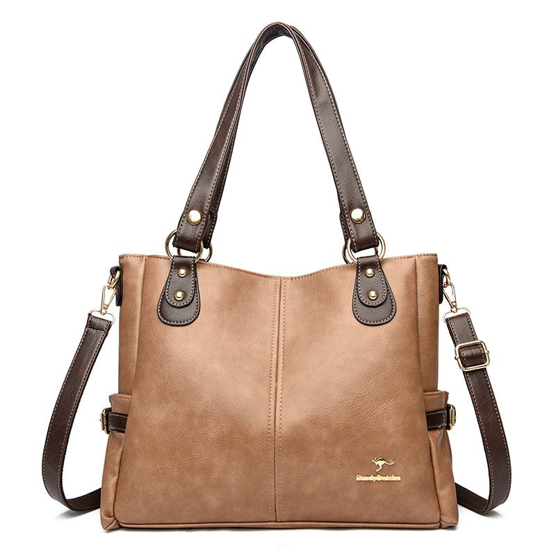 Elegant brun tote handväska i läderlook med justerbar axelrem och guldiga detaljer – Itsbag