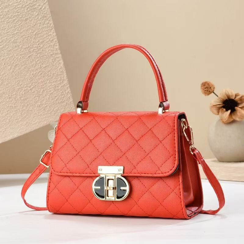 Handväska med dekorativt lås – elegant och tidlös design